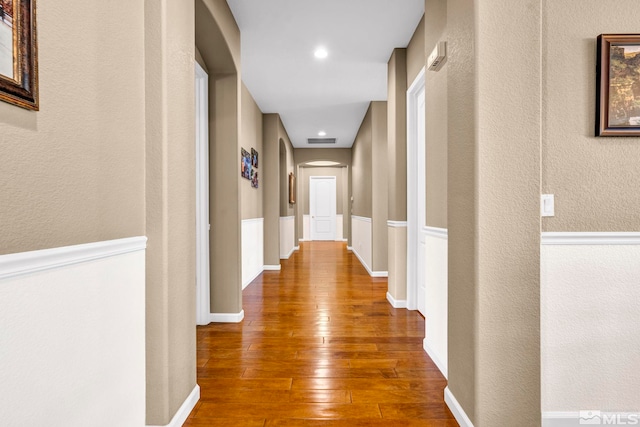 hall with wood-type flooring