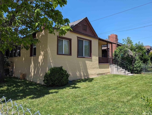 bungalow-style house featuring a front lawn