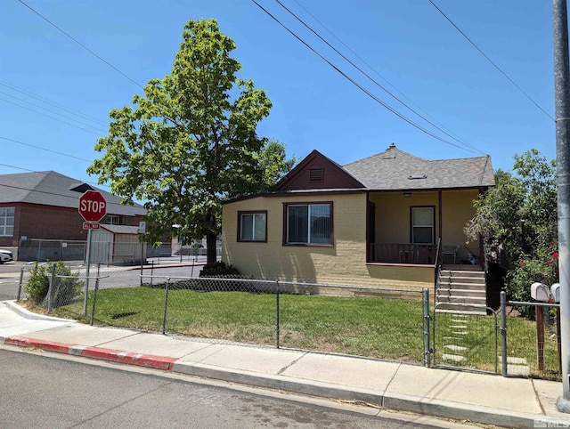 bungalow-style house with a front yard