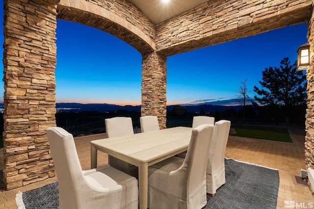 patio terrace at dusk with a mountain view