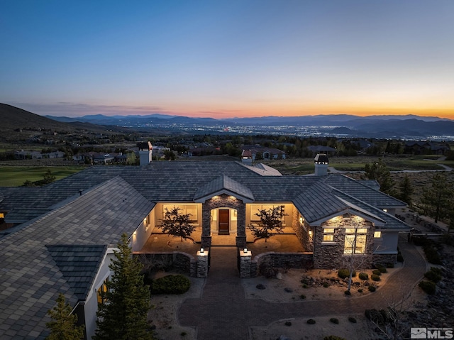 view of front of property with a mountain view