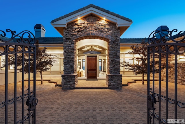 view of exterior entry with a garage