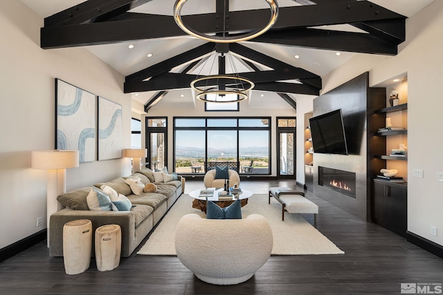 living room featuring dark hardwood / wood-style floors, an inviting chandelier, and vaulted ceiling