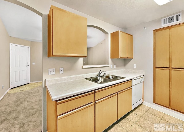 kitchen featuring light carpet, sink, dishwasher, and light brown cabinets