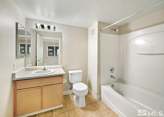 full bathroom featuring tile flooring, washtub / shower combination, a textured ceiling, toilet, and large vanity