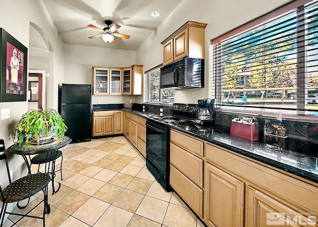 kitchen featuring black appliances, plenty of natural light, ceiling fan, and light tile floors