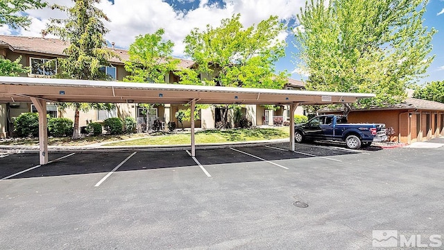 view of parking / parking lot with a carport