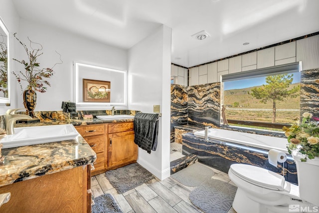 bathroom featuring hardwood / wood-style floors, vanity, and toilet