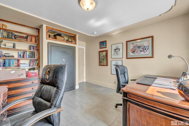 office area featuring a textured ceiling