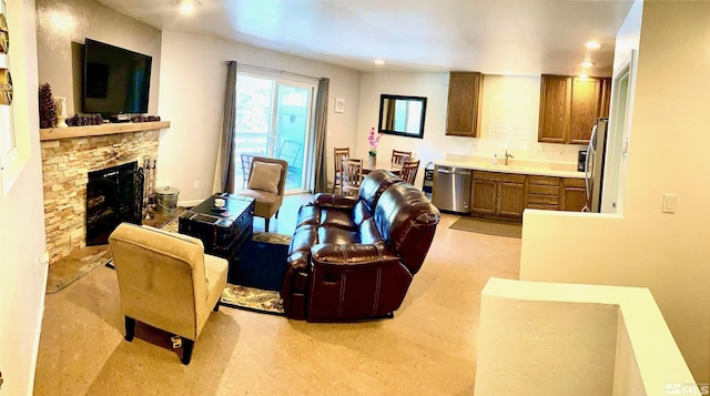 living room featuring a stone fireplace