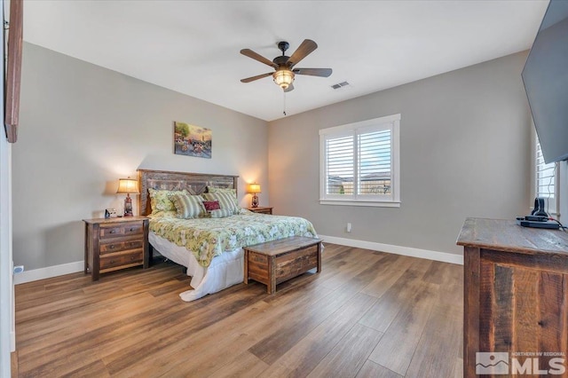 bedroom featuring ceiling fan and hardwood / wood-style flooring