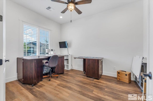 home office with ceiling fan and wood-type flooring