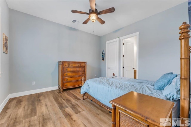 bedroom featuring hardwood / wood-style floors and ceiling fan