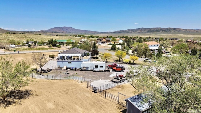 birds eye view of property with a mountain view