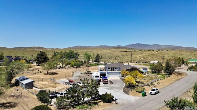 birds eye view of property with a mountain view