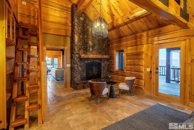 sitting room featuring wood ceiling, a chandelier, high vaulted ceiling, beamed ceiling, and a fireplace