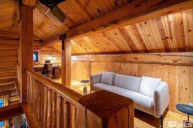 sitting room with vaulted ceiling with beams, light hardwood / wood-style floors, and wooden ceiling