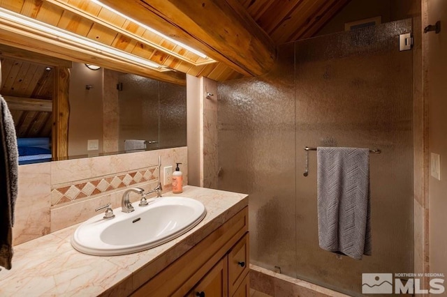 bathroom featuring vanity, a skylight, and backsplash