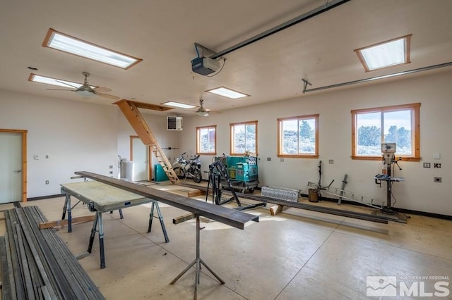 garage featuring a garage door opener and ceiling fan