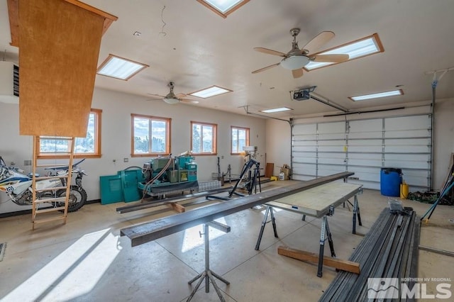 garage featuring ceiling fan and a garage door opener