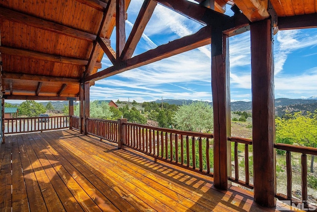 wooden deck featuring a mountain view