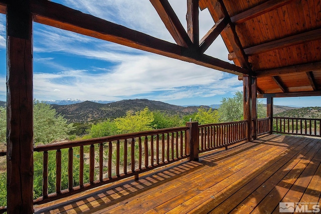 wooden deck featuring a mountain view