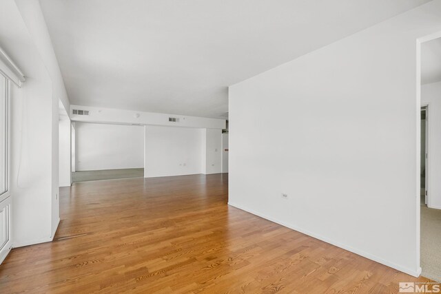 spare room with light hardwood / wood-style flooring