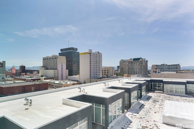 view of patio / terrace with a balcony and a city view