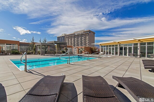 view of pool featuring a patio