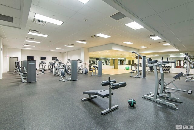 gym featuring a drop ceiling