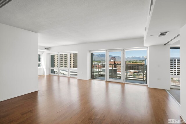 spare room featuring hardwood / wood-style floors