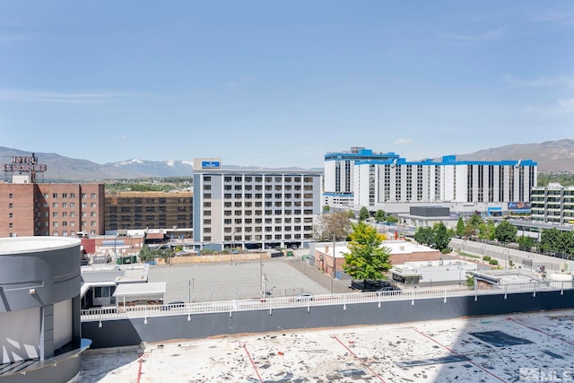 exterior space featuring a mountain view and a city view