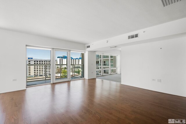 unfurnished room featuring dark hardwood / wood-style floors