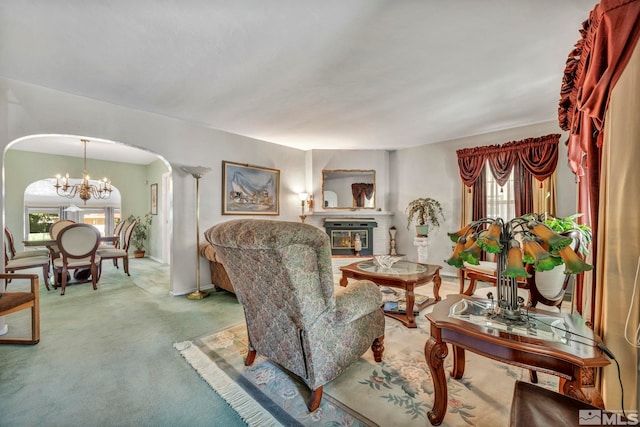 living room with carpet floors and a chandelier