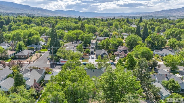 birds eye view of property featuring a mountain view