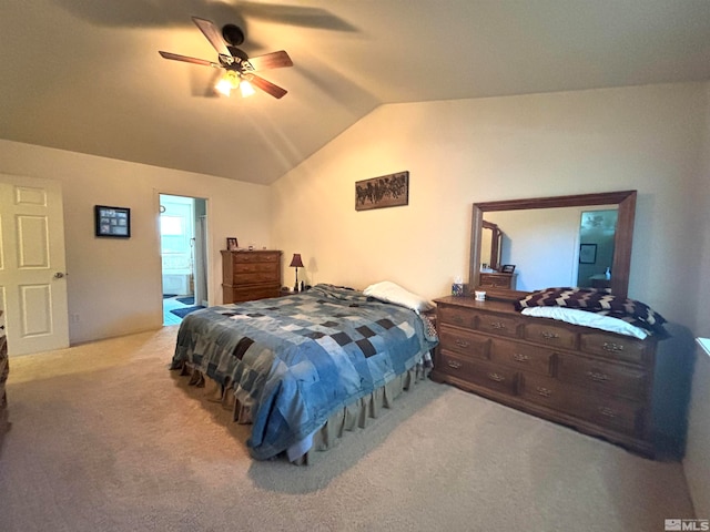 carpeted bedroom with ceiling fan, ensuite bath, and lofted ceiling