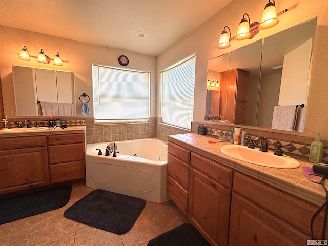 bathroom featuring tile flooring, a bath to relax in, and vanity