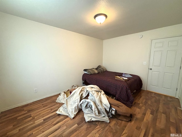 bedroom with wood-type flooring