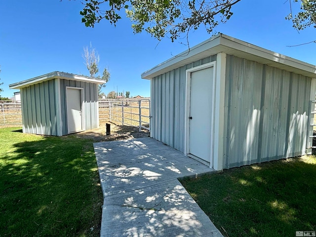 view of shed / structure with a yard