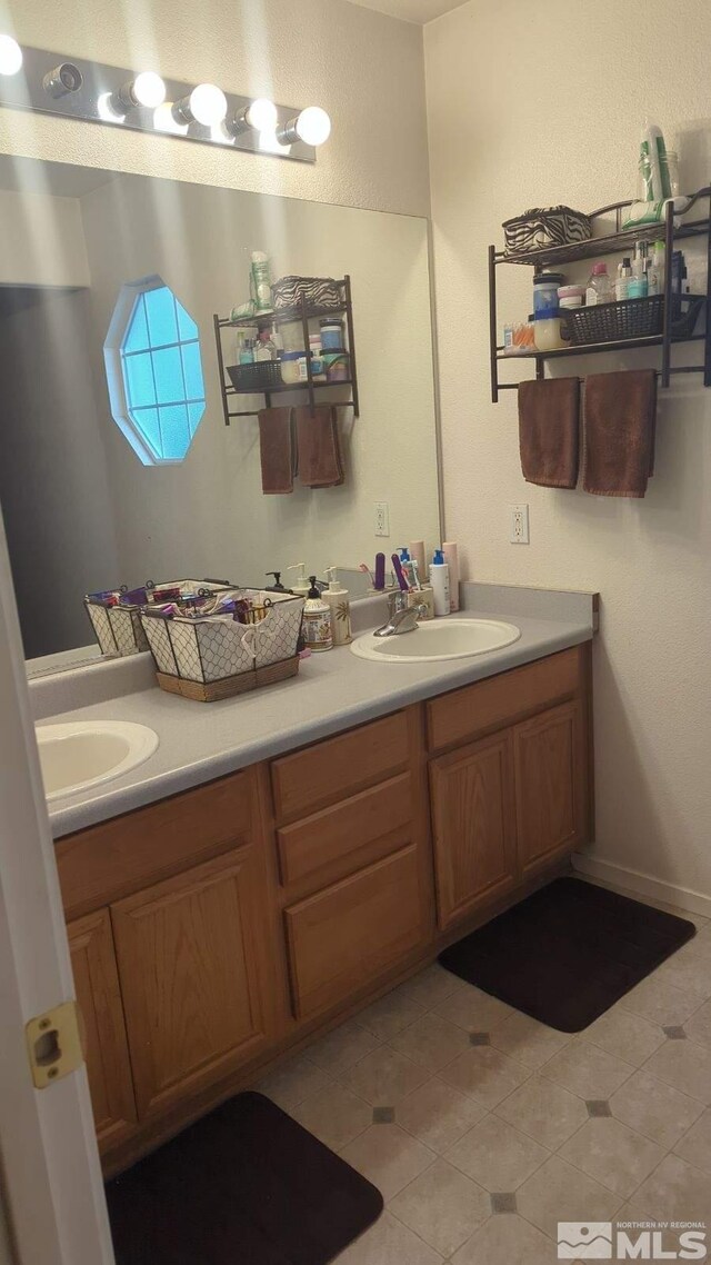 bathroom featuring vanity and tile patterned floors