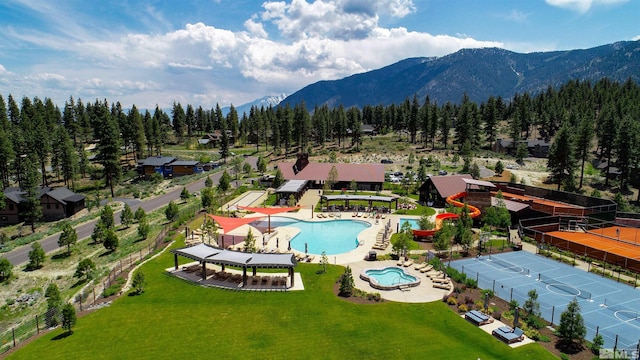 view of swimming pool with a mountain view