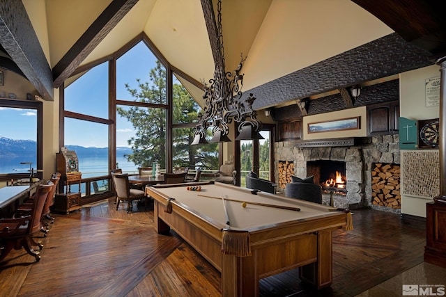 recreation room with a fireplace, high vaulted ceiling, billiards, a water view, and dark wood-type flooring