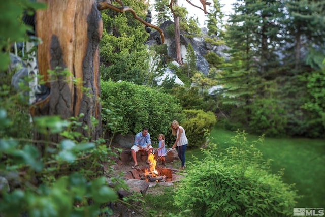 exterior space with a fire pit