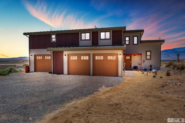 view of front of house featuring a mountain view and a garage