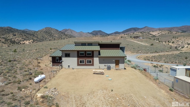 rear view of property featuring a mountain view