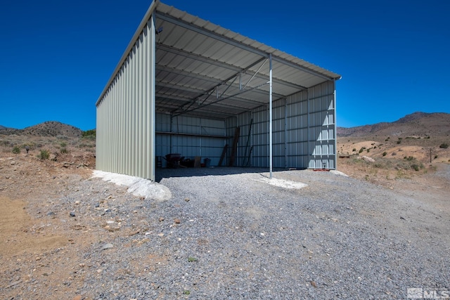 view of outbuilding featuring a mountain view