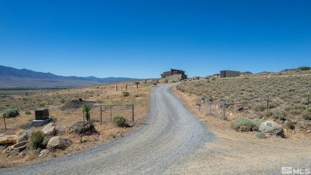 view of street with a mountain view and a rural view