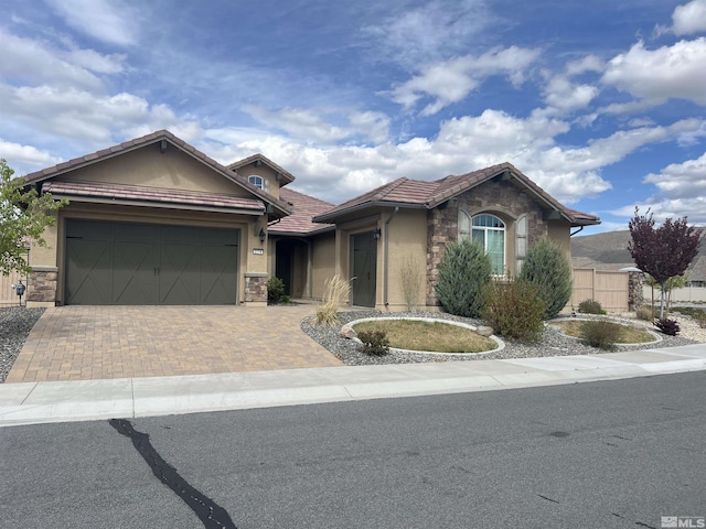 ranch-style home featuring a garage