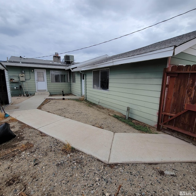 back of property with a patio and central air condition unit