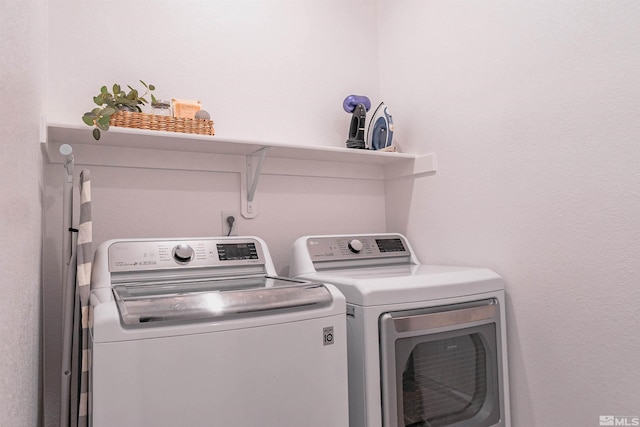 laundry room featuring washing machine and dryer